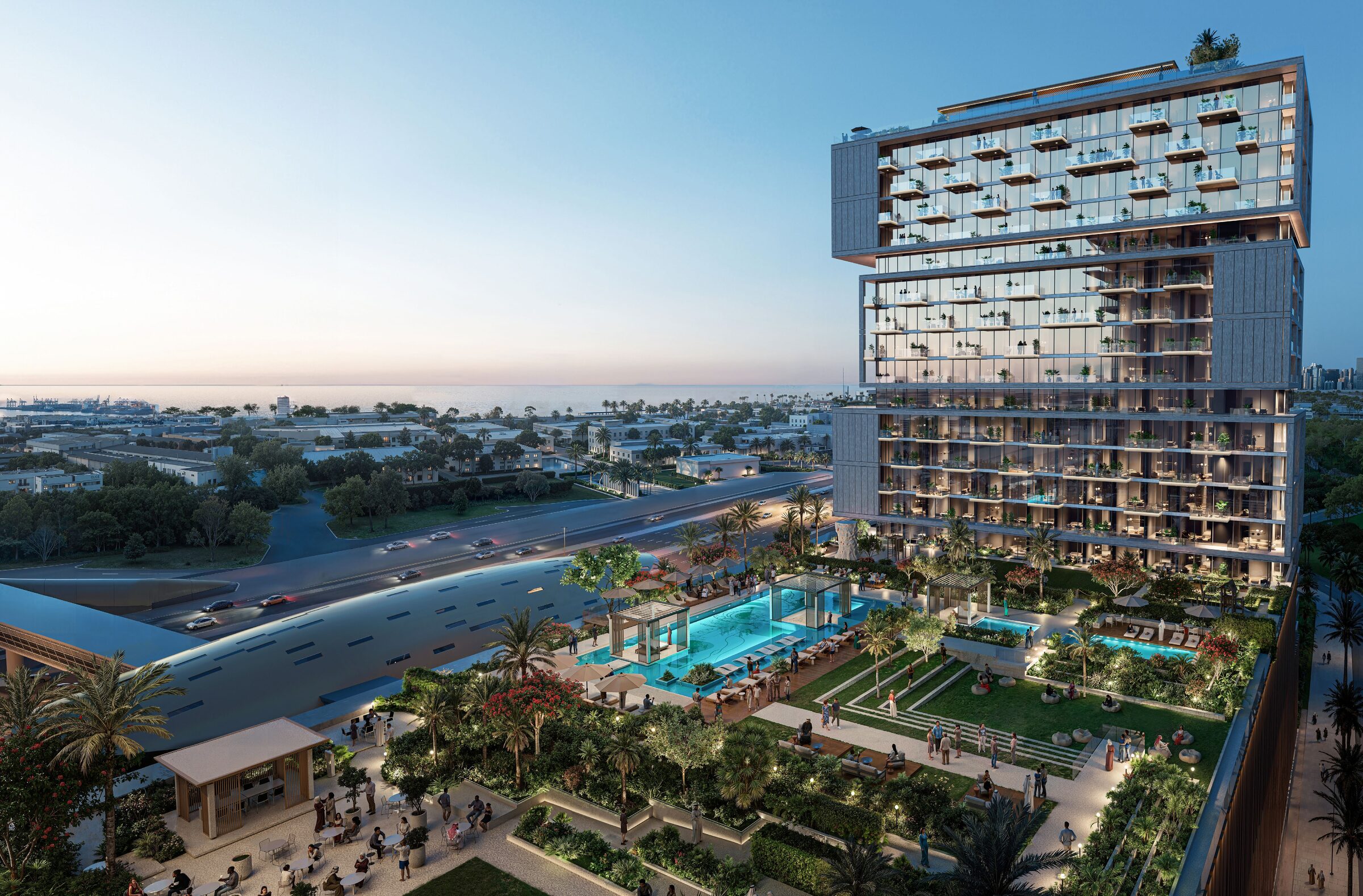 Torre di RAW District con podio e piscine, vista verso il mare e l'area di JAFZA al tramonto