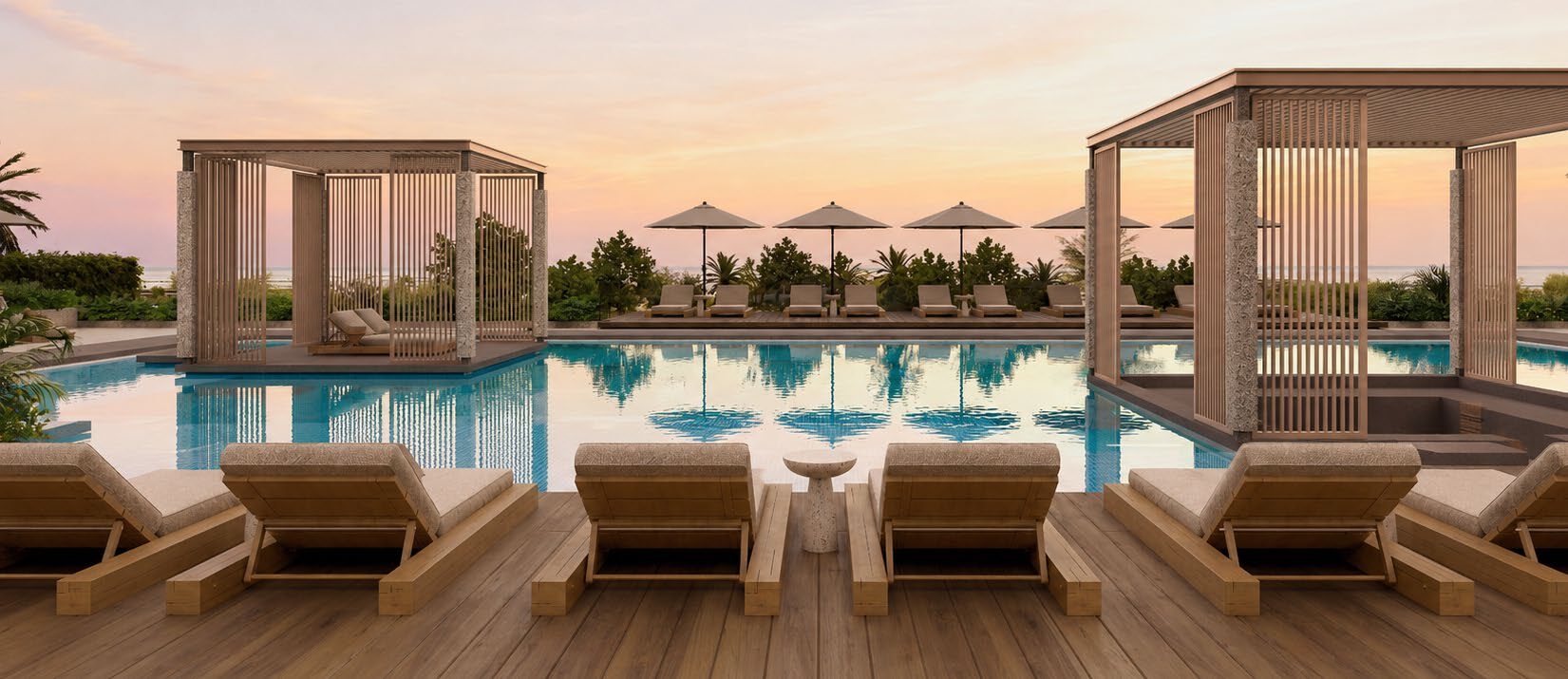 Piscina sul rooftop di RAW District al tramonto con cabana e vista panoramica sulla città